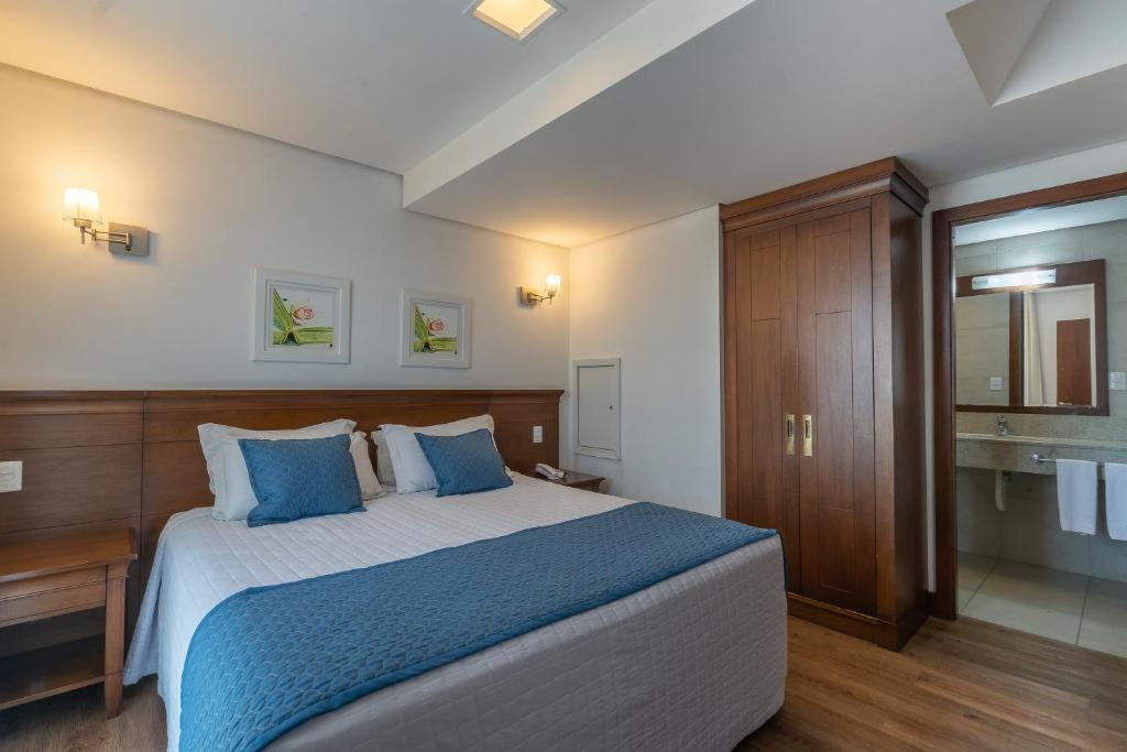 Postel nebo postele na pokoji v ubytování Hotel Monte Felice Centro