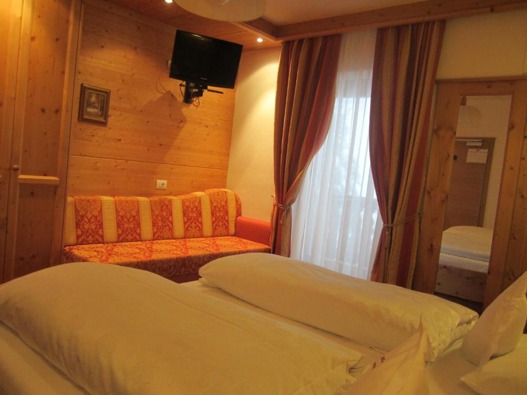 Postel nebo postele na pokoji v ubytování Hotel Ronce