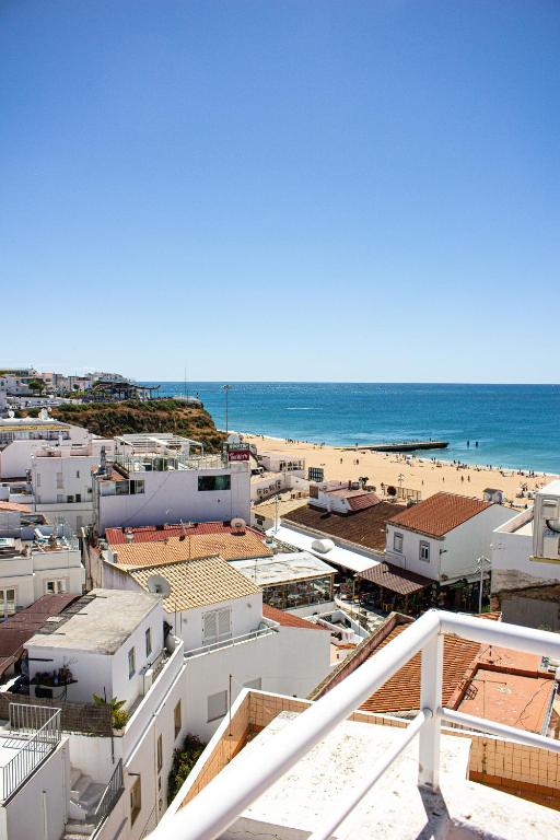a view of a beach from a building at Casa Clementina in Albufeira