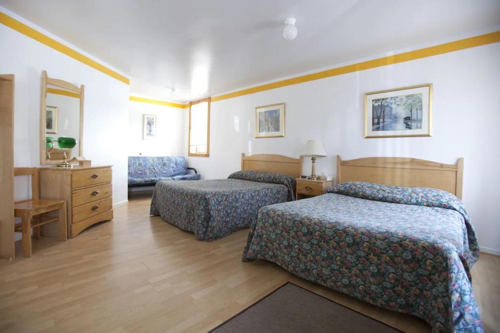 Postel nebo postele na pokoji v ubytování Hotel - Motel Georges