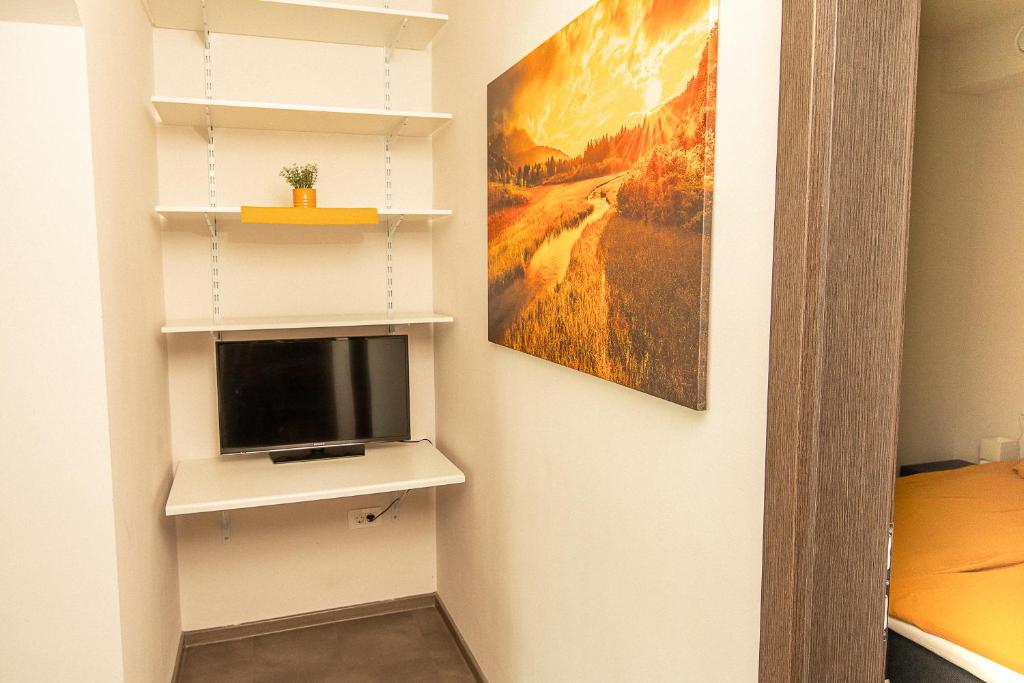 TV a/nebo společenská místnost v ubytování DB Bled Apartment