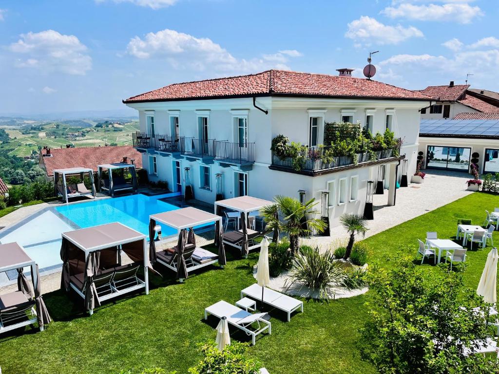 an aerial view of a villa with a swimming pool at Villa Nonna Cicci Boutique Hotel - SPA in Cisterna dʼAsti