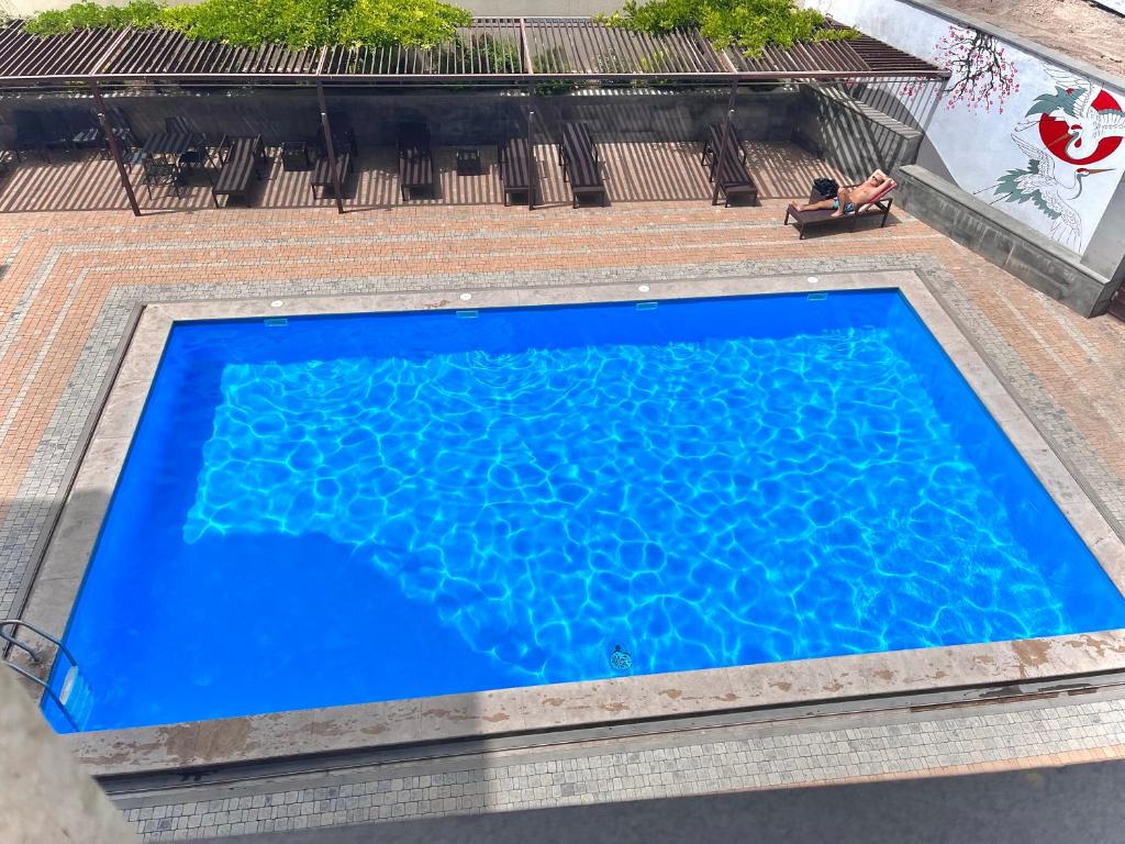 an overhead view of a blue swimming pool at Bien hotel in Yerevan