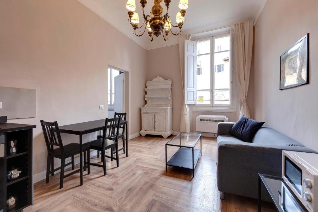 a living room with a couch and a table at Ginori 3P in Florence