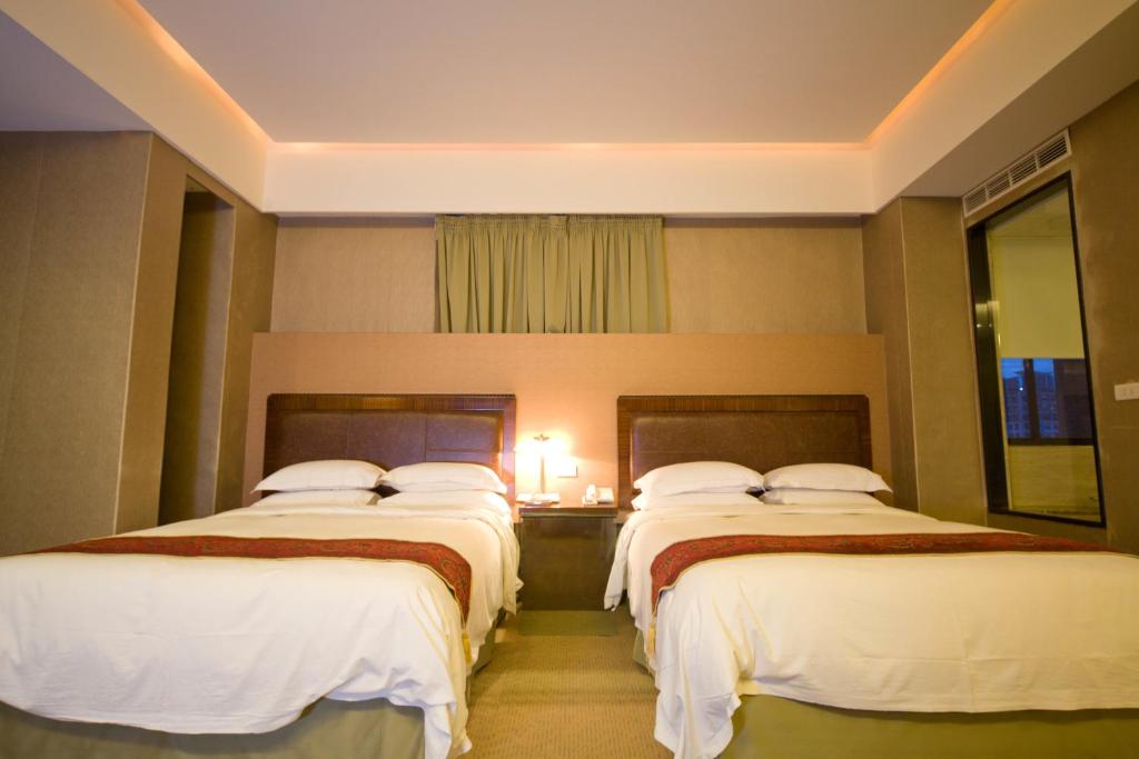 Postel nebo postele na pokoji v ubytování Resort One Hotel