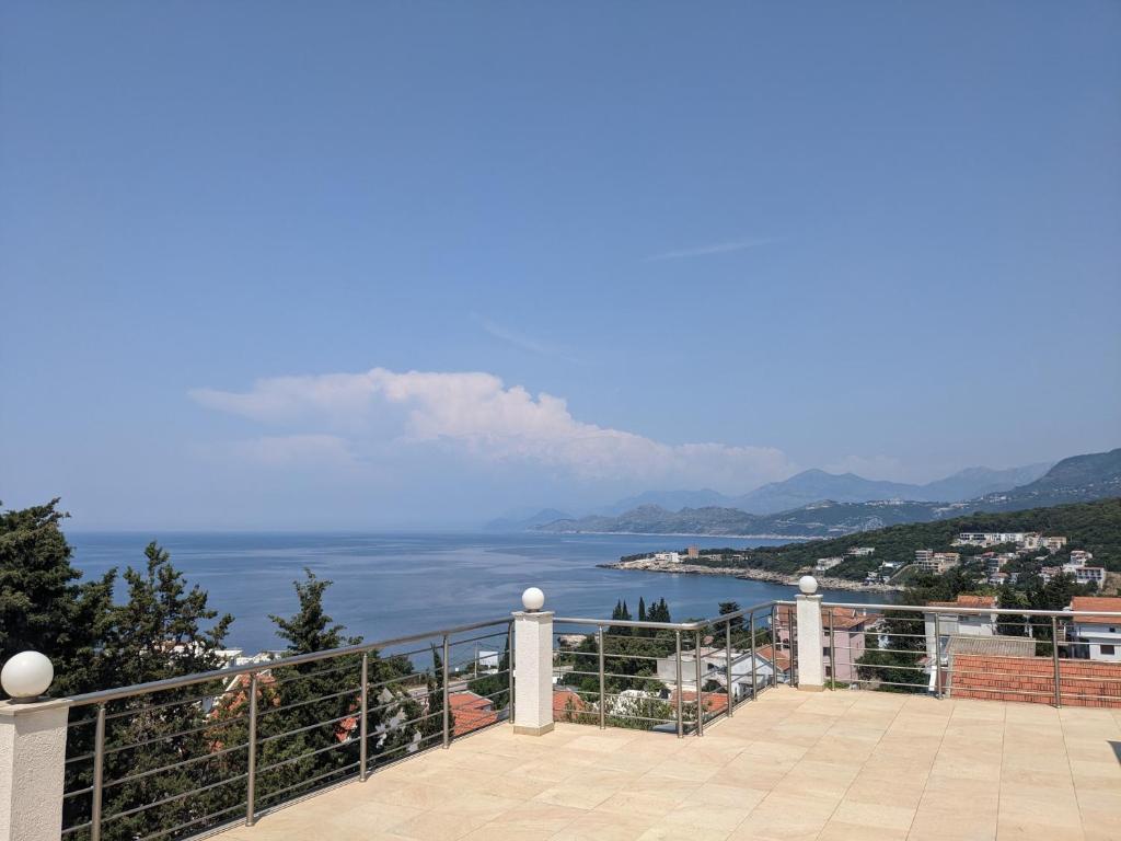 a view of the ocean from a balcony at Serene Sea View Apartments in Utjeha in Utjeha