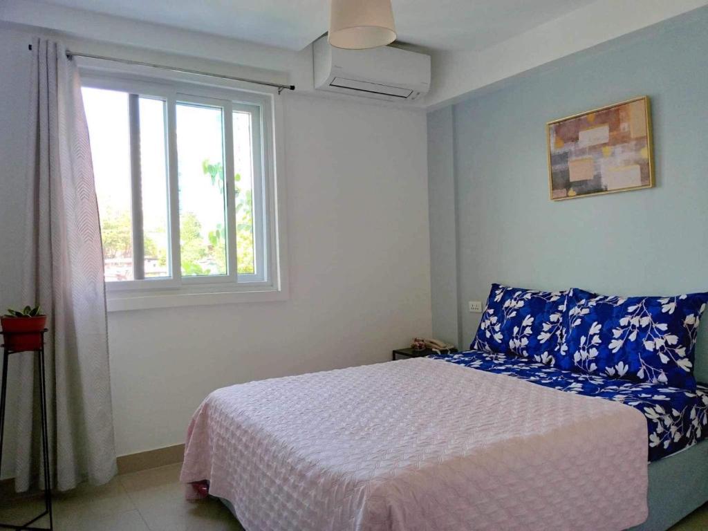 Postel nebo postele na pokoji v ubytování Cebu Mini Hotel