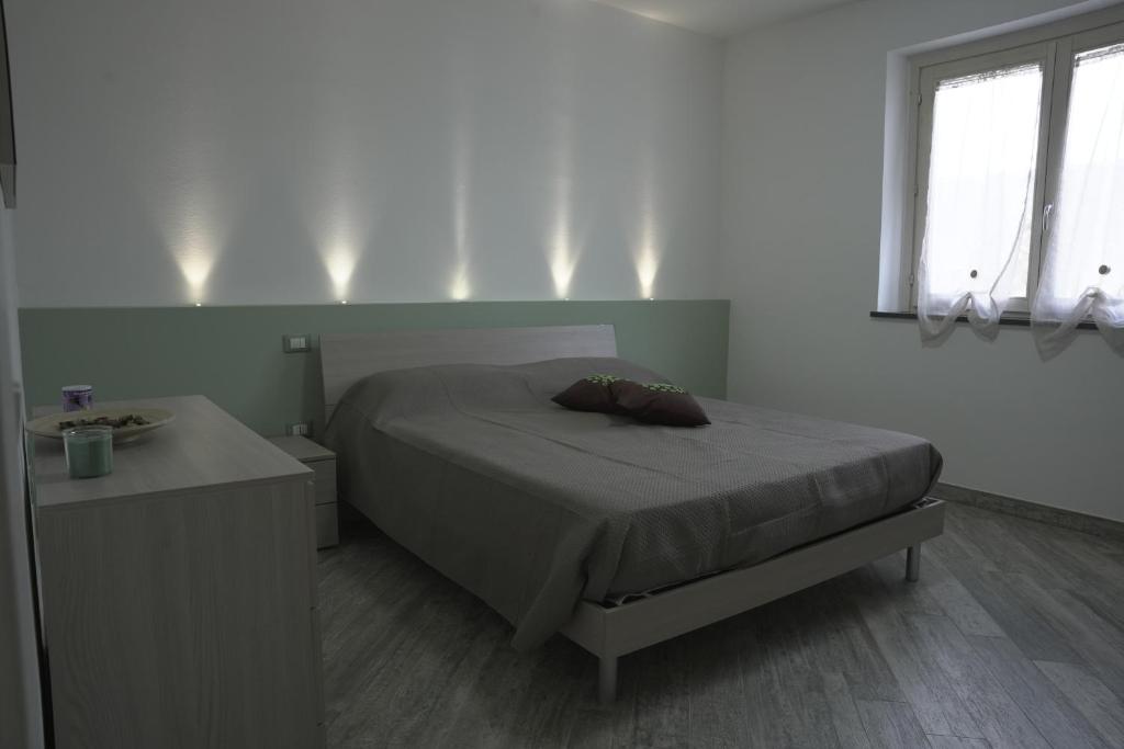 Postel nebo postele na pokoji v ubytování L'ANGOLO VERDE