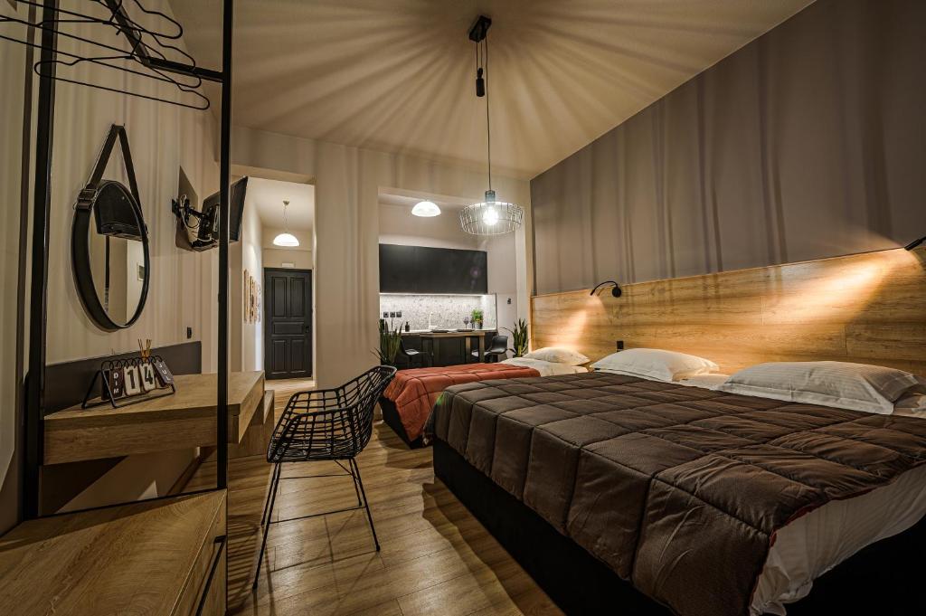 Postel nebo postele na pokoji v ubytování Eleni Zirganou Studios & Apartments