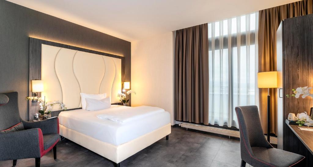 Postel nebo postele na pokoji v ubytování Best Western Plaza Hotel Mannheim