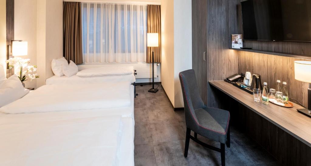Postel nebo postele na pokoji v ubytování Best Western Plaza Hotel Mannheim