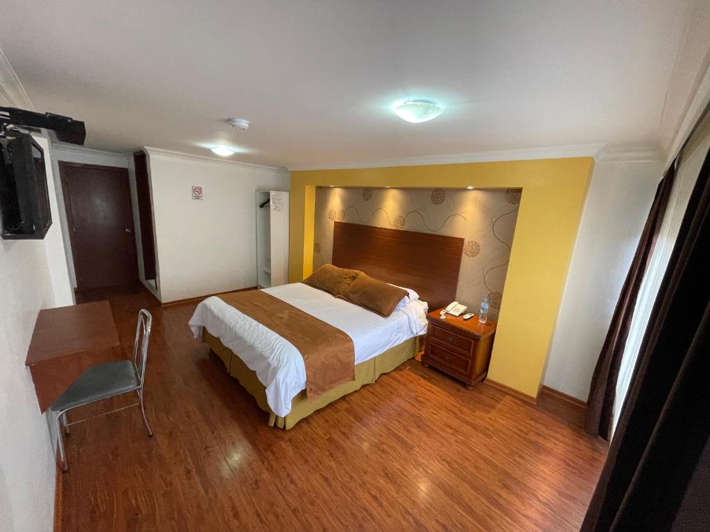 Postel nebo postele na pokoji v ubytování Gran Hotel Napoleón