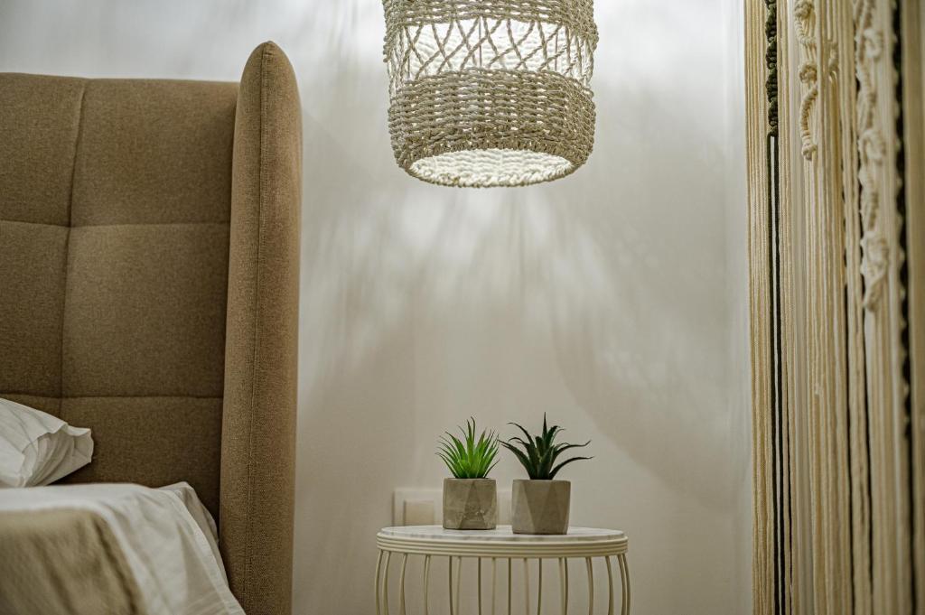 Postel nebo postele na pokoji v ubytování Eleni Zirganou Studios & Apartments