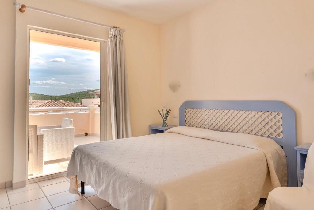 Posteľ alebo postele v izbe v ubytovaní Residence a Golfo di Marinella a 450 mt dal mare