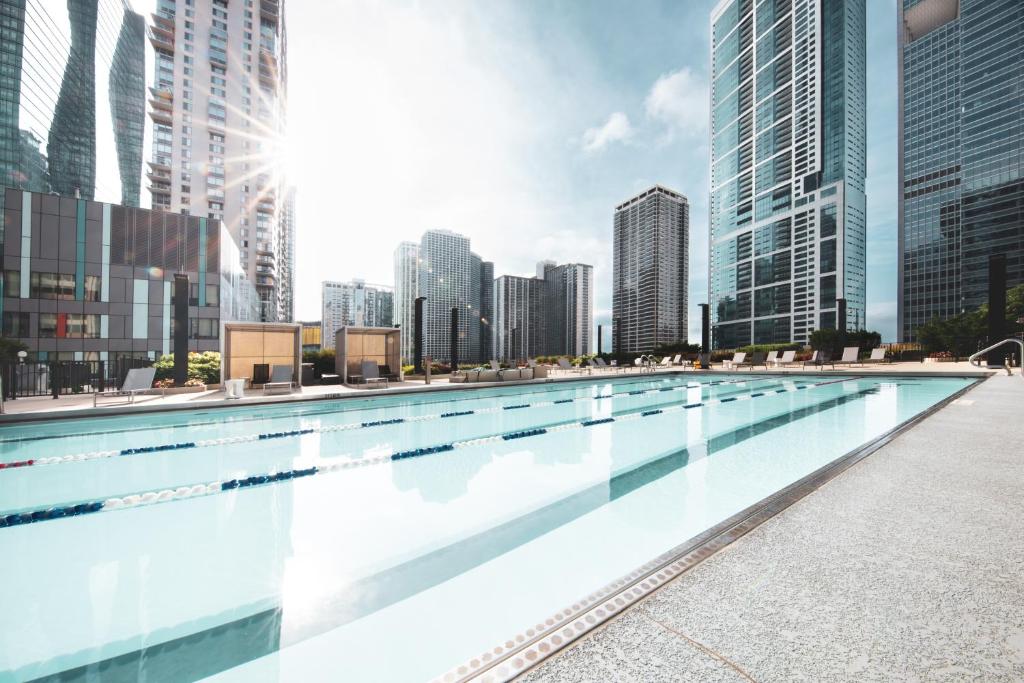 a large swimming pool in a city with tall buildings at Radisson Blu Aqua Hotel, Chicago in Chicago