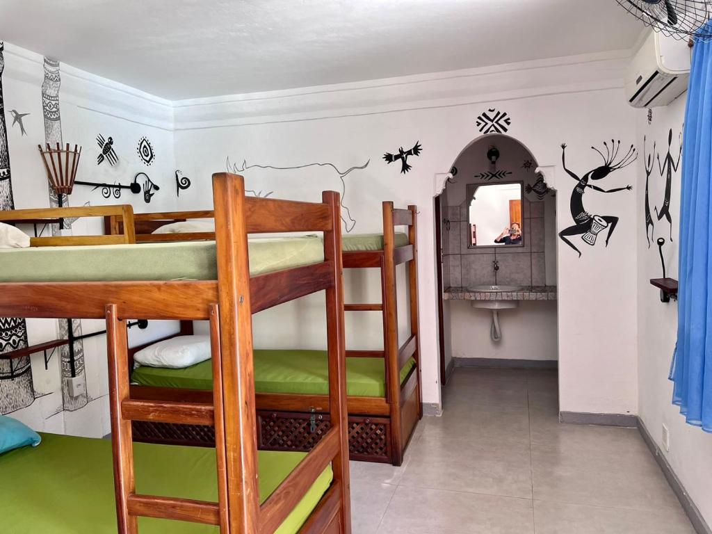 Postel nebo postele na pokoji v ubytování Na Casa 11 - Pousada e Hostel