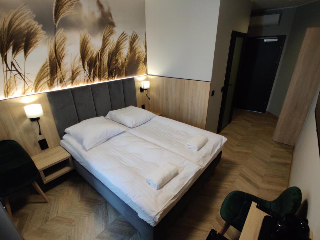 Postel nebo postele na pokoji v ubytování Nowe M4 Żyrardów Centrum - blisko Suntago