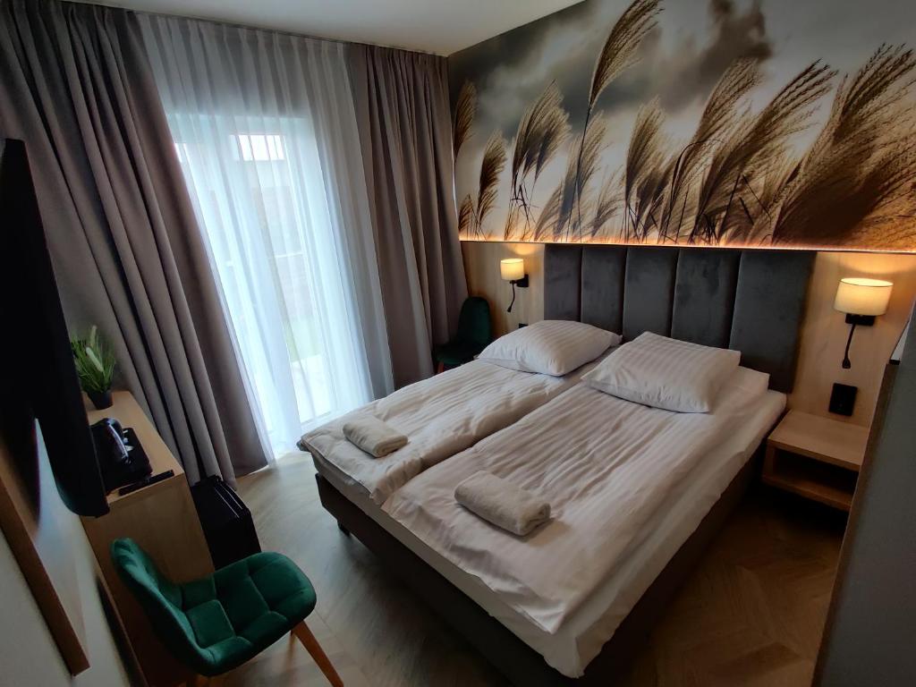 Postel nebo postele na pokoji v ubytování Nowe M4 Żyrardów Centrum - blisko Suntago
