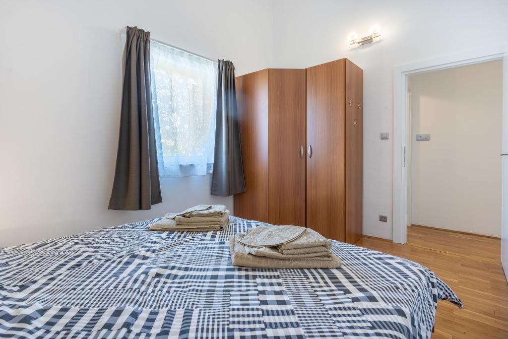 Posteľ alebo postele v izbe v ubytovaní Apartman Atika