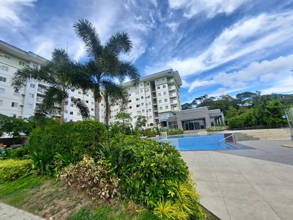 a skate park in front of a building with a palm tree at Amaia Steps Altaraza by GEMcondotel in Tunkong Manga