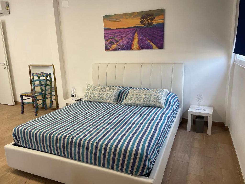 Postel nebo postele na pokoji v ubytování -DIMARTINO HOME- Posizione centrale 9 min da Marzamemi San Lorenzo Portopalo di Capo Passero