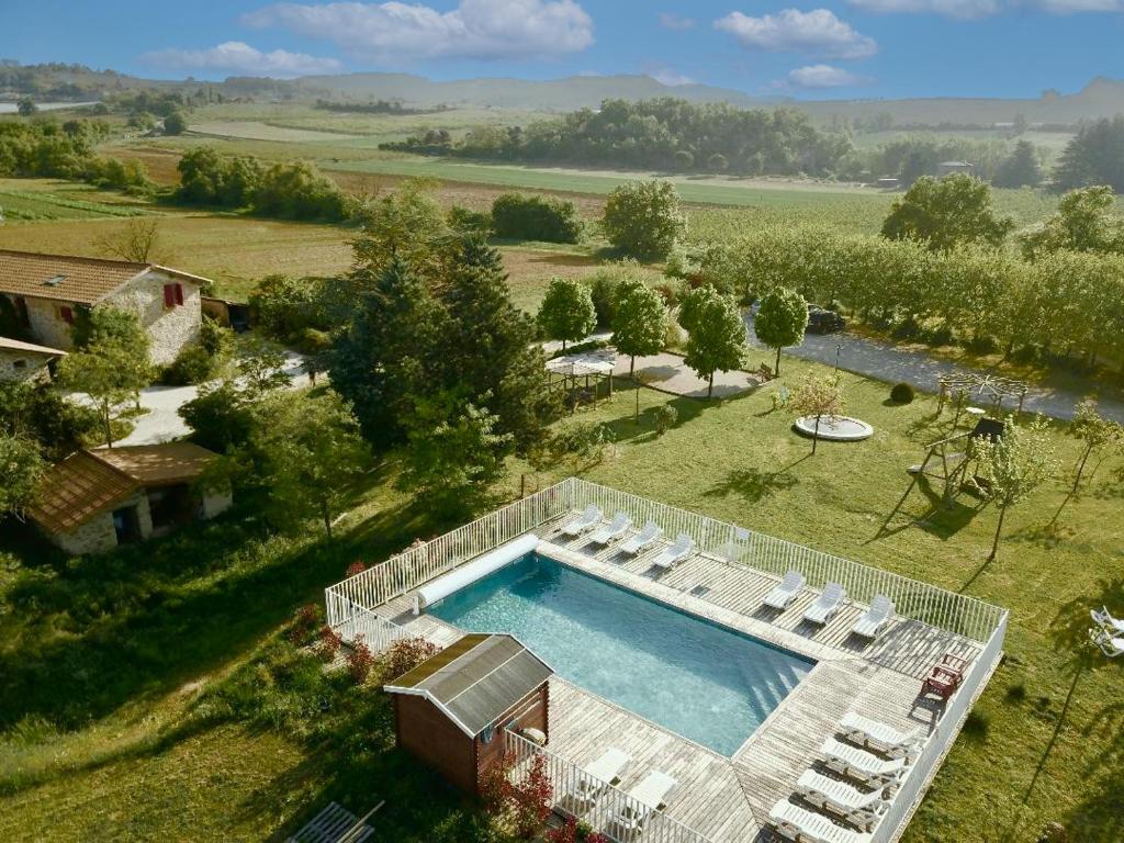 an aerial view of a swimming pool in a field at Ferme Robin in Marsaz