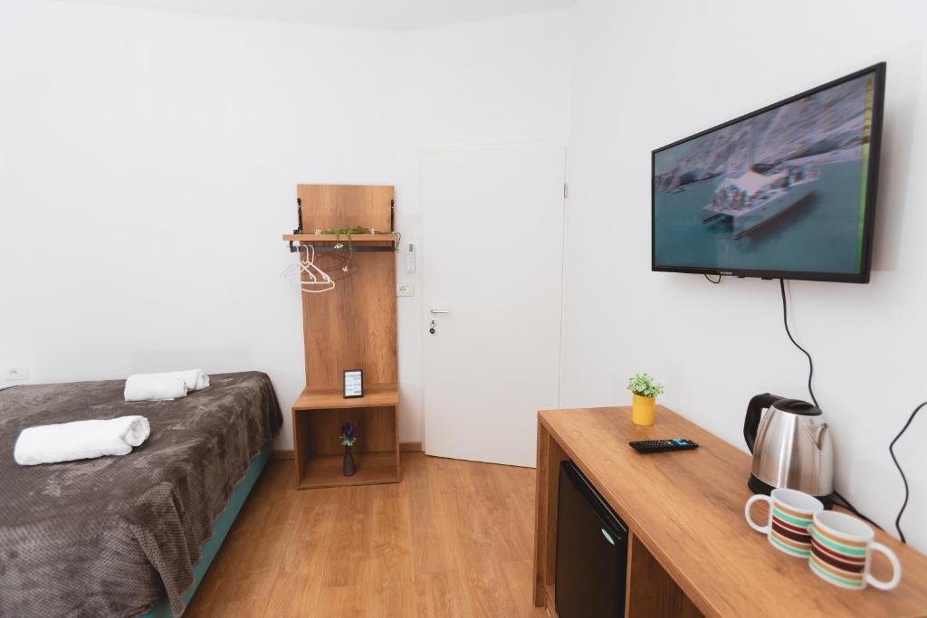 TV a/nebo společenská místnost v ubytování Hotel Tier Center