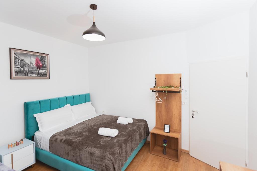 Postel nebo postele na pokoji v ubytování Hotel Tier Center