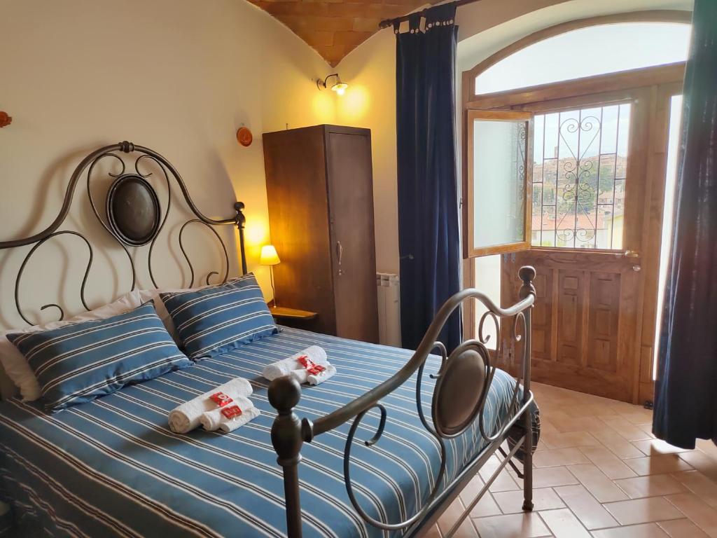 Llit o llits en una habitació de le stanze della Terrazza sul Borgo