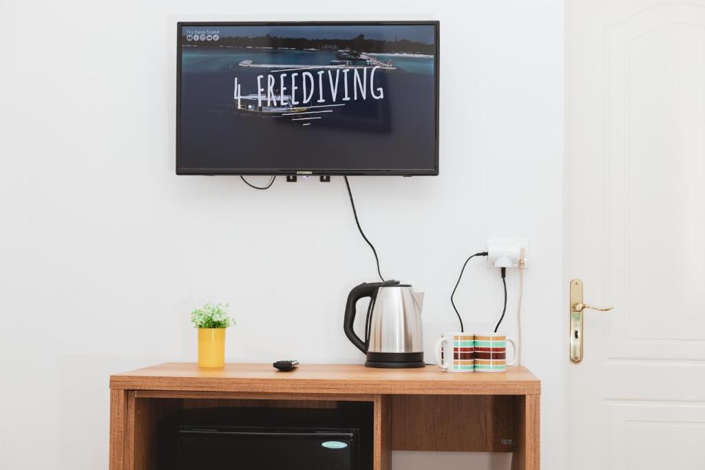 TV a/nebo společenská místnost v ubytování Hotel Tier Center