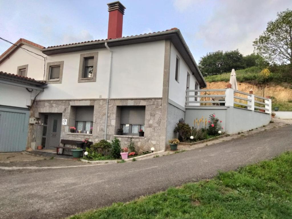 a house on the side of the road at Alvares de Corvera in El Pontón