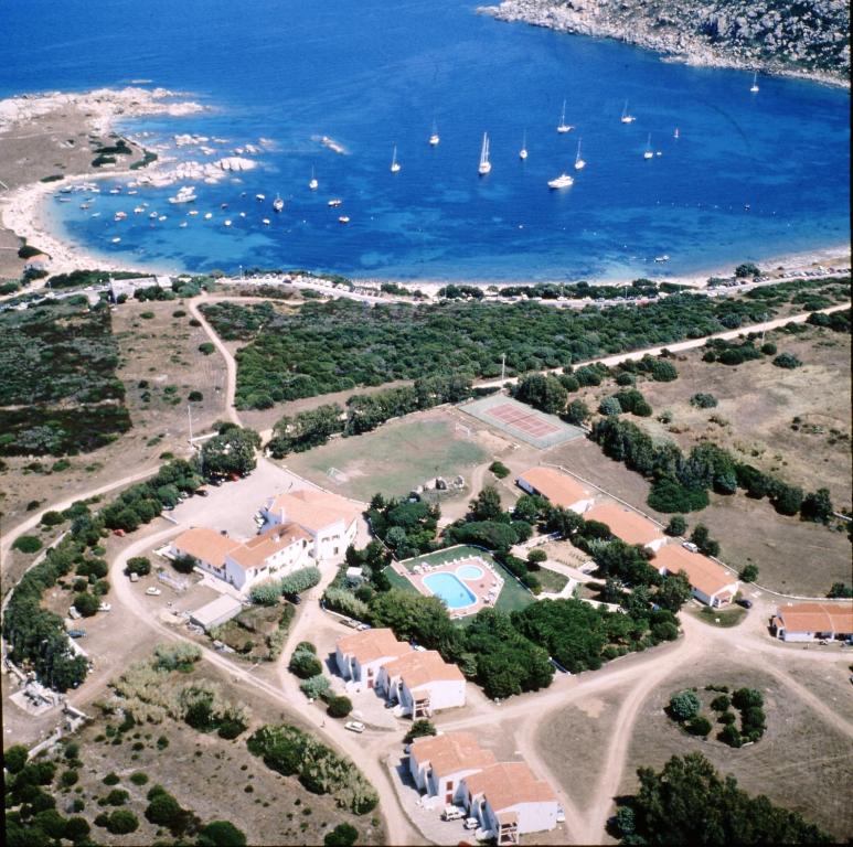 an aerial view of a resort with boats in the water at Hotel Mirage in Santa Teresa Gallura