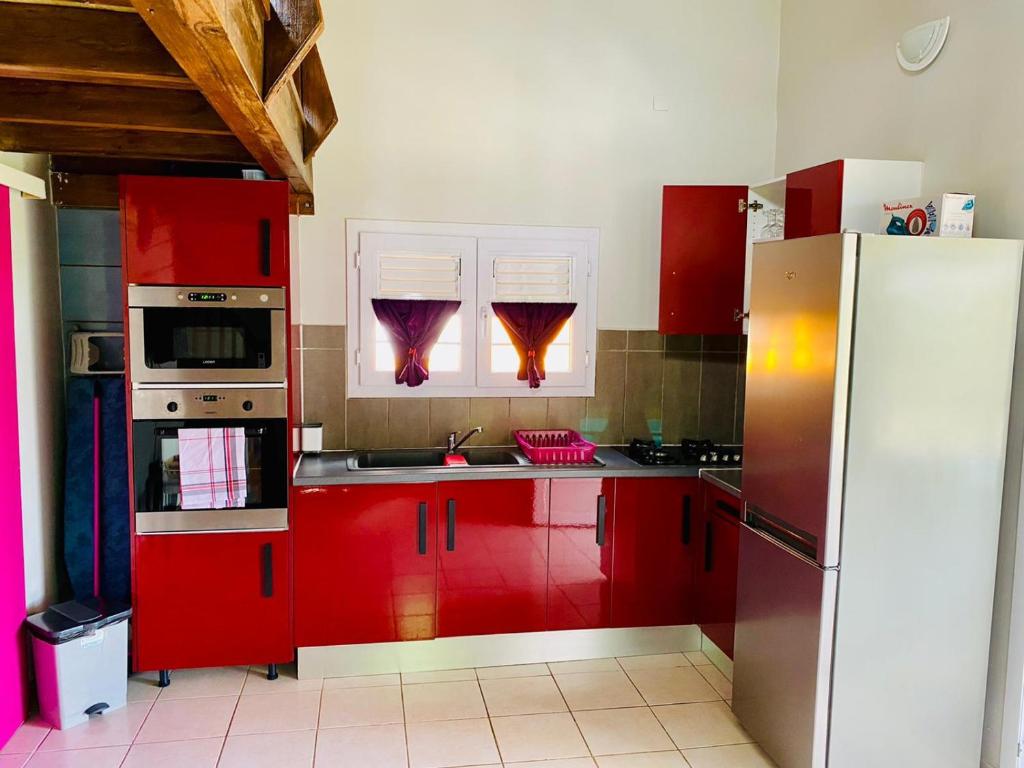Kuchyň nebo kuchyňský kout v ubytování Bungalows Arc en Ciel