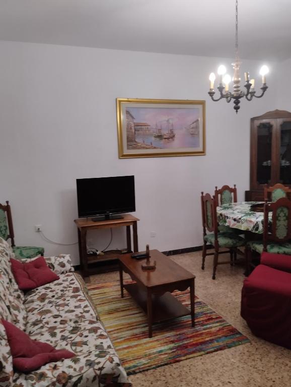 Televízia a/alebo spoločenská miestnosť v ubytovaní Casa Graziella