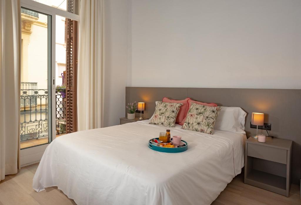 Postel nebo postele na pokoji v ubytování Antonios Hostal