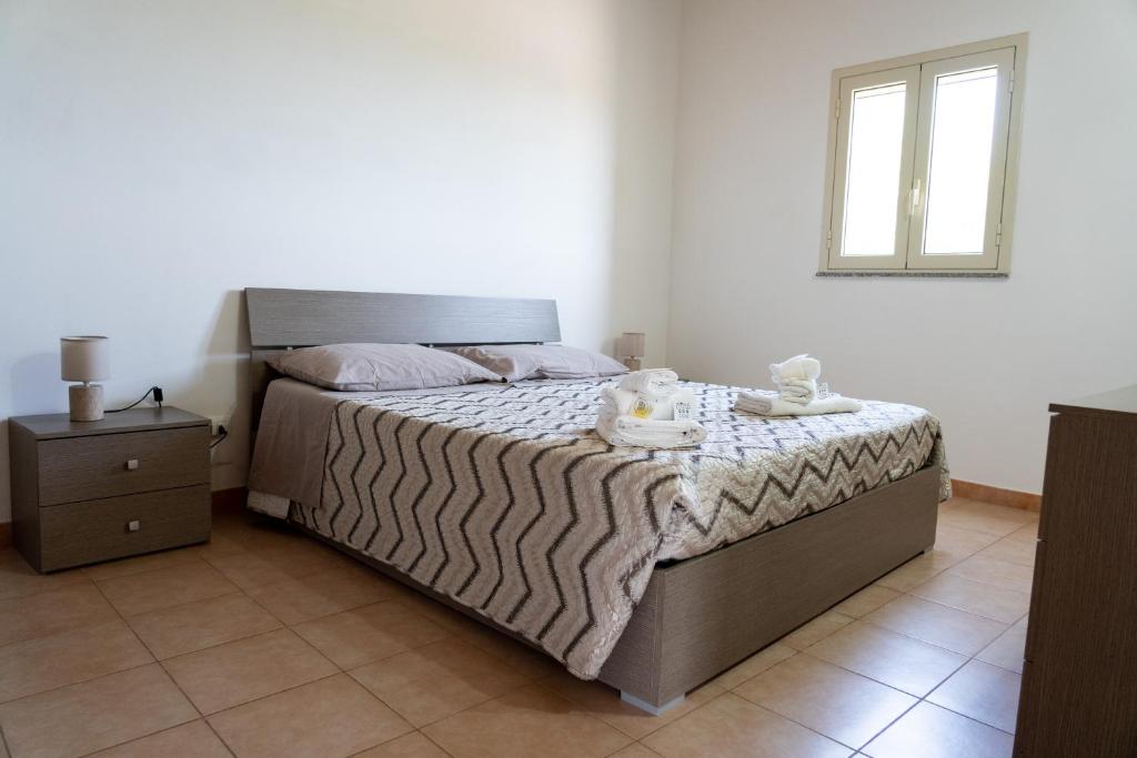 Postel nebo postele na pokoji v ubytování B&B L'Uliveto Rooms & Pool