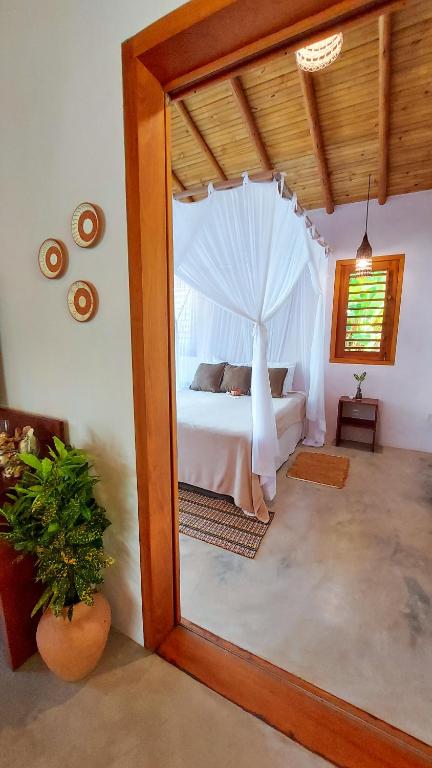 Postel nebo postele na pokoji v ubytování Vila dos Macacos Trancoso