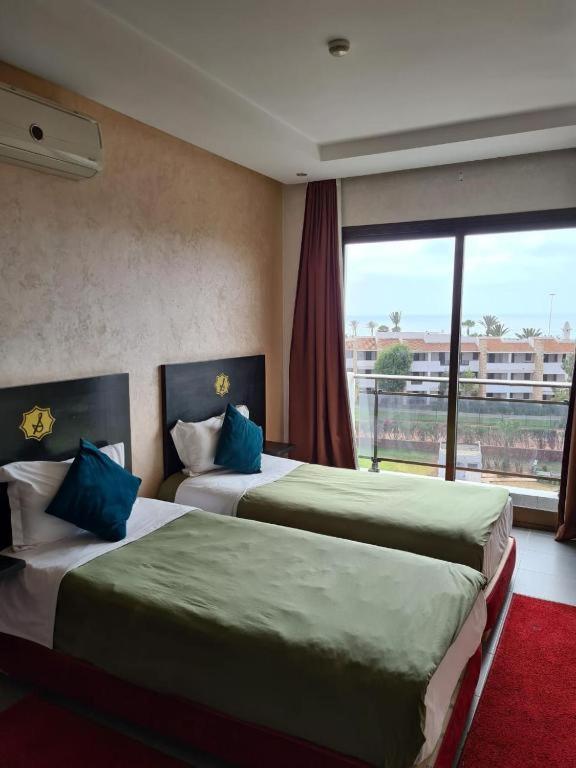Postel nebo postele na pokoji v ubytování La Suite Hotel Agadir Adults Only