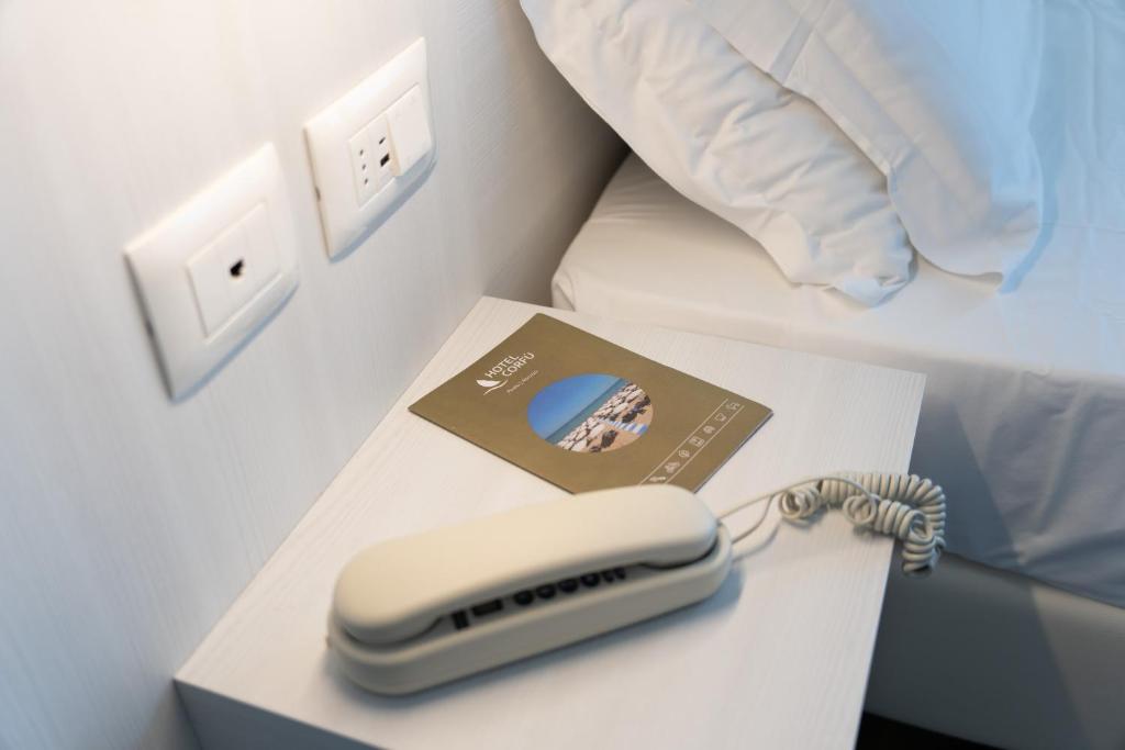 Postel nebo postele na pokoji v ubytování Hotel Corfù
