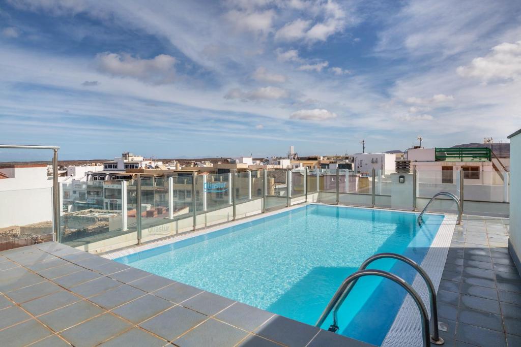 a swimming pool on the roof of a building at Casa Yerida in El Cotillo