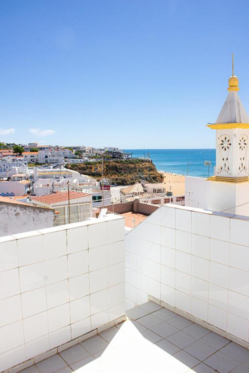 a view of the beach from the roof of a building at Casa Maria in Albufeira