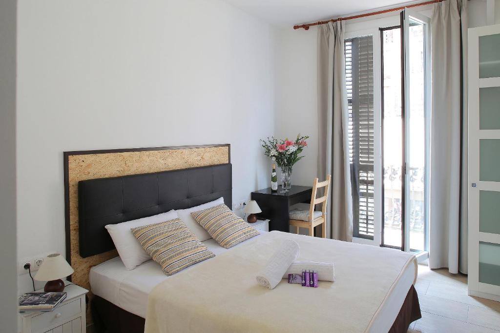 Posteľ alebo postele v izbe v ubytovaní Hostal Balkonis