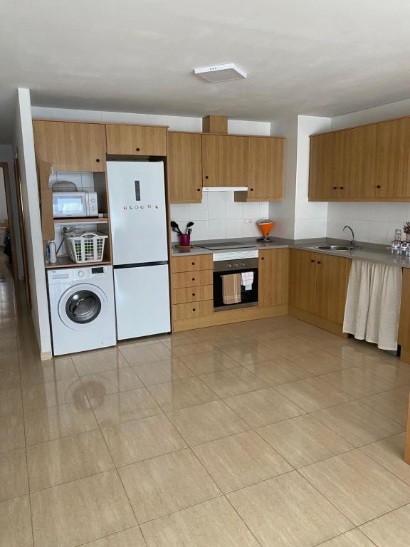 Kuchyň nebo kuchyňský kout v ubytování Apartamentos Wei