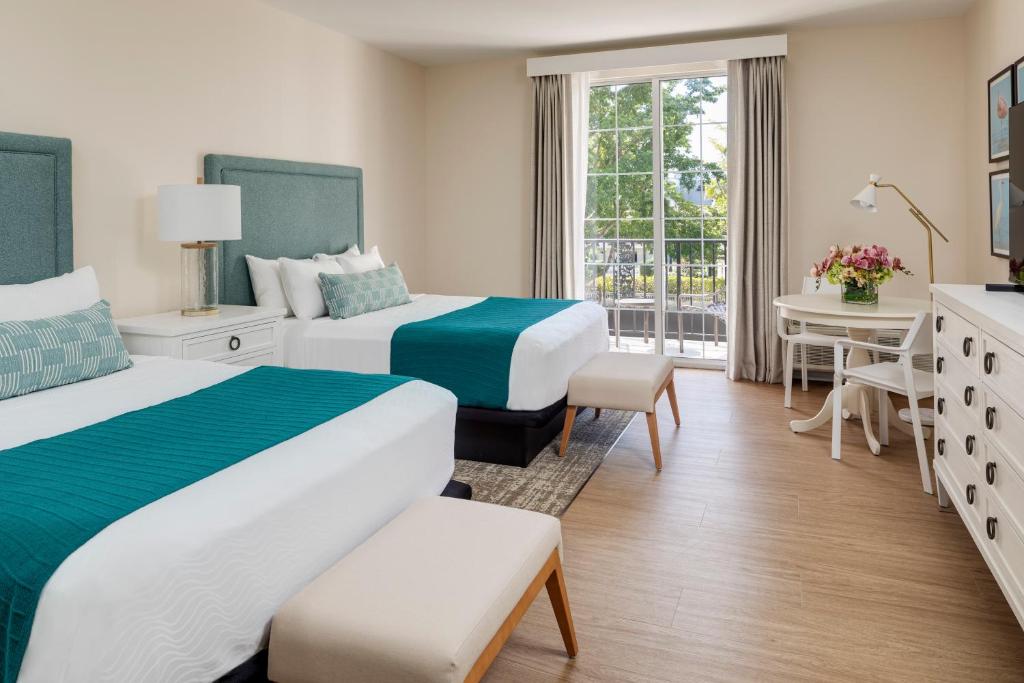 Postel nebo postele na pokoji v ubytování The Capri Inn