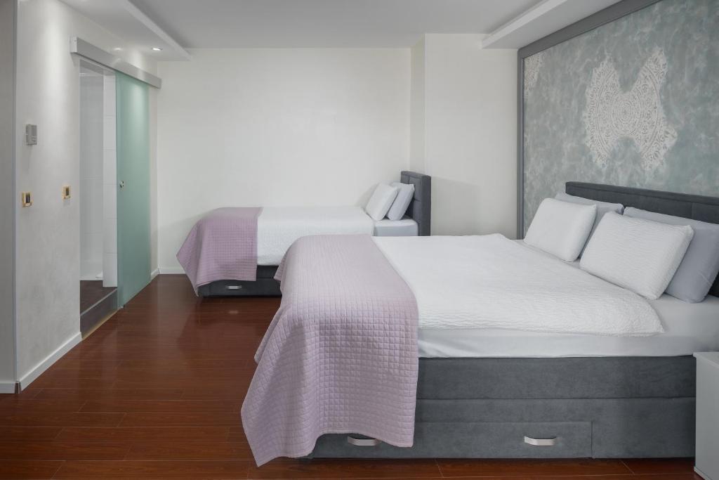 Postel nebo postele na pokoji v ubytování Hotel Tomi