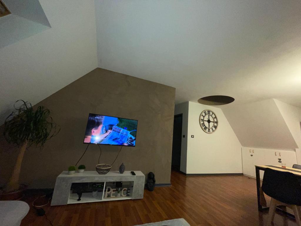 Телевизор и/или развлекательный центр в Appartement Dôme