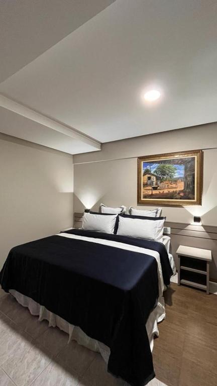 Postel nebo postele na pokoji v ubytování Hotel Dan Inn Uberlandia By Nacional Inn