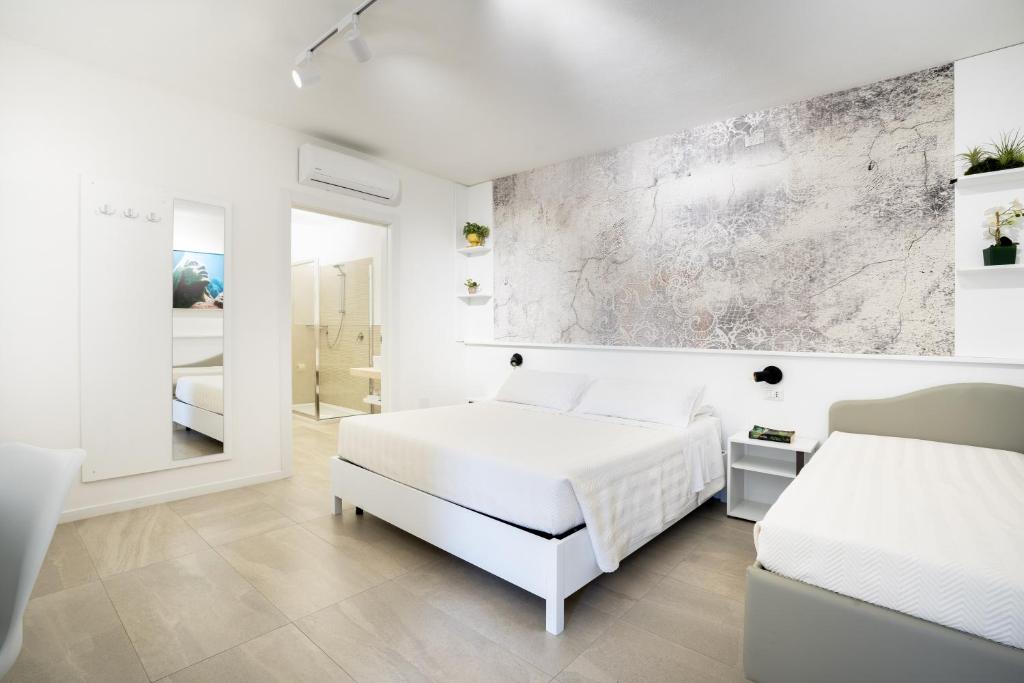 Postel nebo postele na pokoji v ubytování Istedda Boutique Hotel