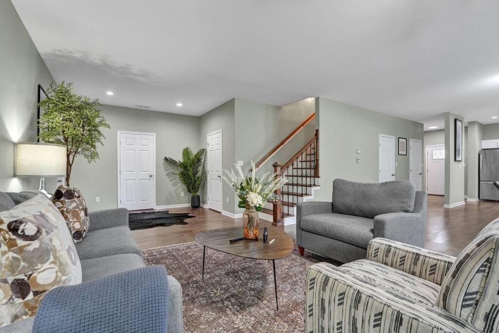 a living room with a couch and a table at The Clark at Midtown Memphis in Memphis