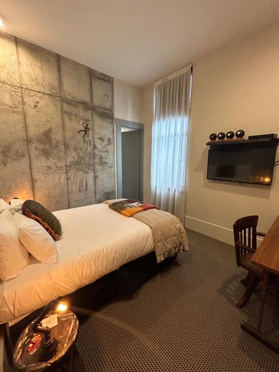 Postel nebo postele na pokoji v ubytování Poshtel